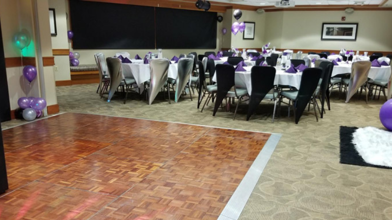 event room with colorful balloons throughout